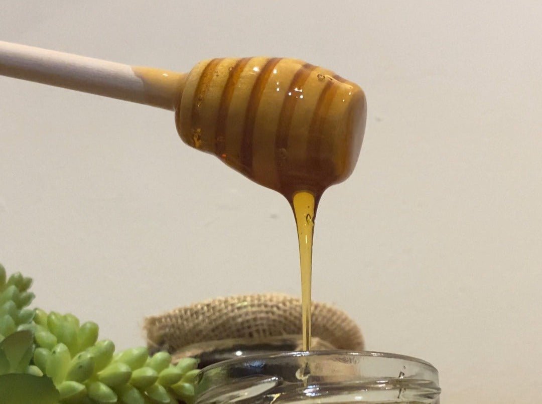 A honey dipper is a wooden or metal utensil designed to drizzle honey smoothly without dripping. Its grooved head allows for easy honey collection and controlled release over food or in beverages. This classic tool is durable, easy to use, and ideal for enjoying honey with minimal mess.