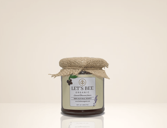 200G jar of Organic spanish thousand flowers honey with it's sticker and the piece of brown textil on top.